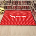 ファッションネットレッドの贅沢なアクセサリーSupremeファッション純色カーペットLVリビングルームには床敷きが敷き詰められている